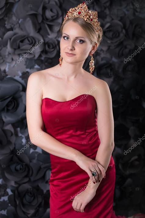 Beautiful Young Blonde Woman In Red Long Dress With Fluffy Skirt On A