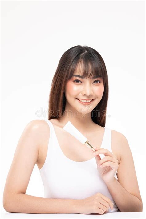 Beautiful Young Asian Woman Holding Luxury White Clean Tube Smile Stock