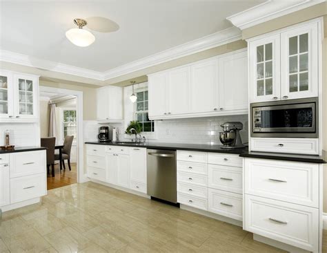 Gorgeous kitchen with ceiling height white cabinetry accented with. Kitchen cabinet crown molding ideas kitchen traditional ...