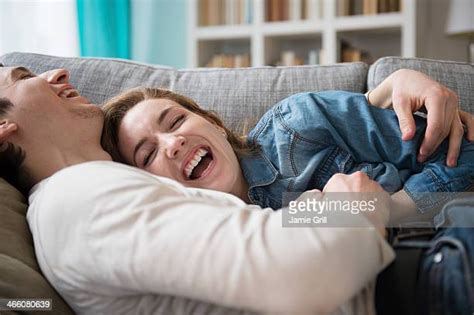 Couple Cuddling Sofa Photos Et Images De Collection Getty Images