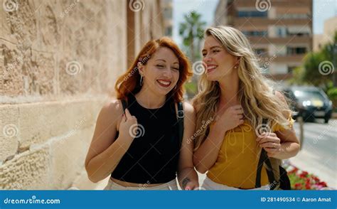 Two Women Speaking And Walking Together At Street Stock Photo Image
