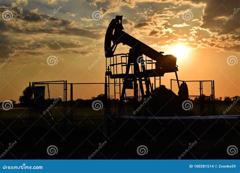 Silhouette Of A Pumpjack During Twilight Time Stock Photo Image Of