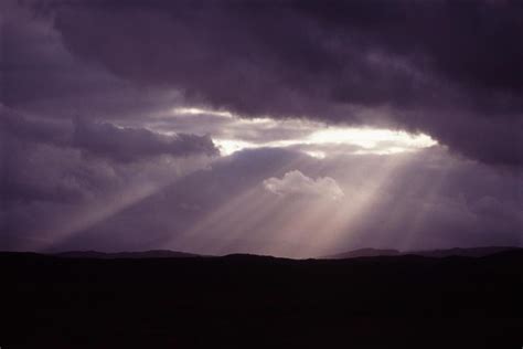 Free Image Of Strong Sunrays Shining Through Heavy Storm Clouds