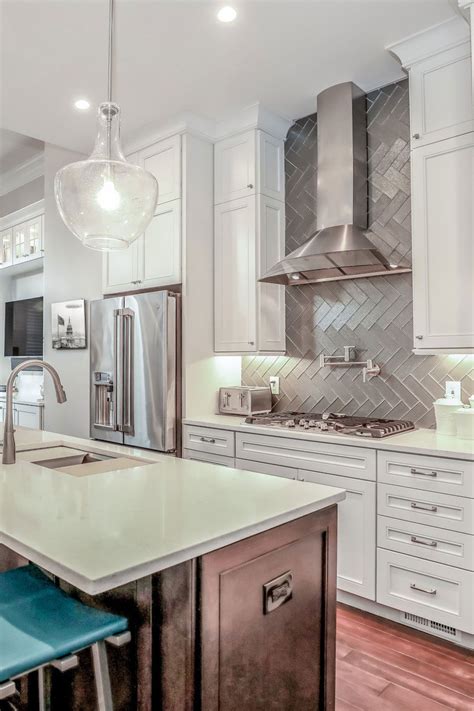 It's often the focal point of the room and a perfect opportunity to introduce pattern and color into the embrace simplicity and choose white backsplash tiles. Pin on Herringbone Backsplash Tile Ideas