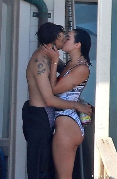 Dua lipa proudly showed off the newest addition to her and boyfriend anwar hadid's family on friday (july 31) when she shared photos of an adorable black rescue puppy in a series of photos on instagram. Dua Lipa Wears Versace Swimsuit With Anwar Hadid ...