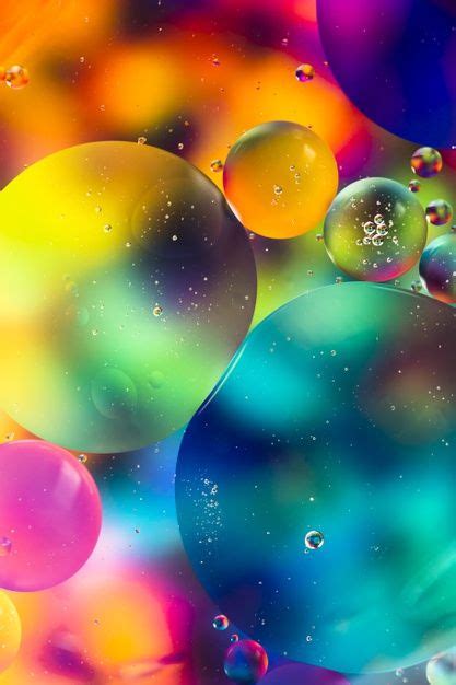 Rainbow Oil Drops On A Water Surface Abstract Background Free Photo