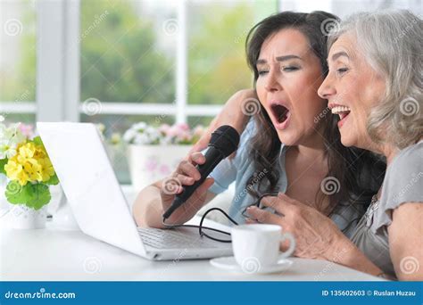 Two Mature Women Singing Karaoke With Laptop Stock Image Image Of Karaoke Gentle 135602603