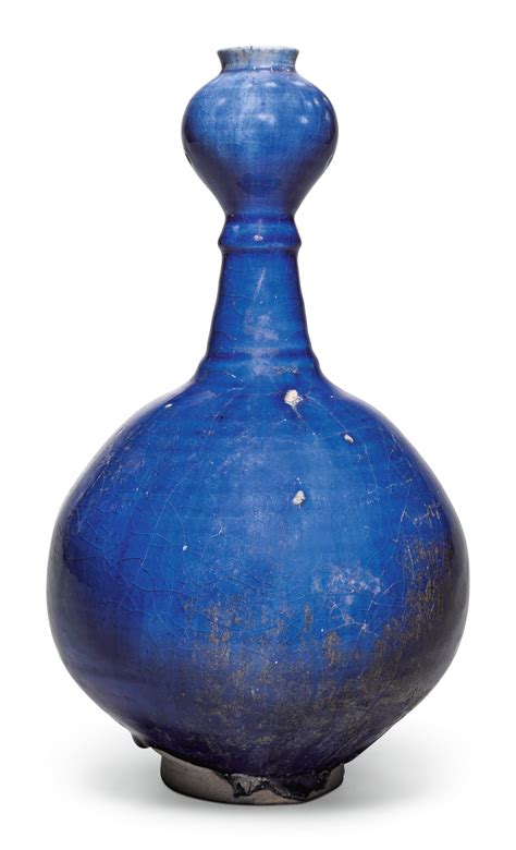 an intact kashan blue glazed bottle vase persia 12th 13th century arts of the islamic world