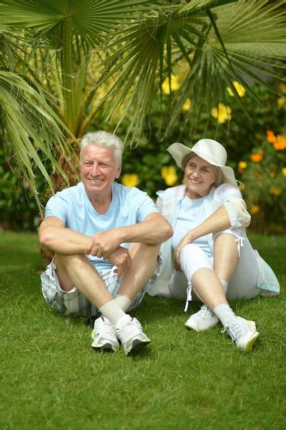 Premium Photo Elderly Couple Sitting On Grass