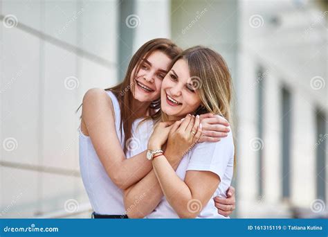 Adult Daughter Hugs Mom And Both Are Smiling At The Camera Stock Image Image Of People Adult