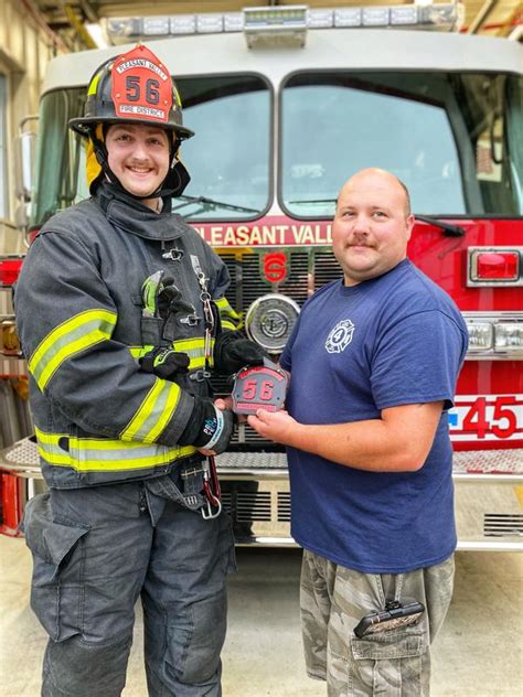 Two Former Probationary Firefighters Get Their New Helmet Shields