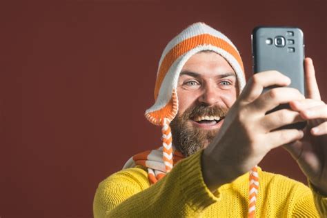 Premium Photo Close Up Portrait Of A Cheerful Bearded Man Taking