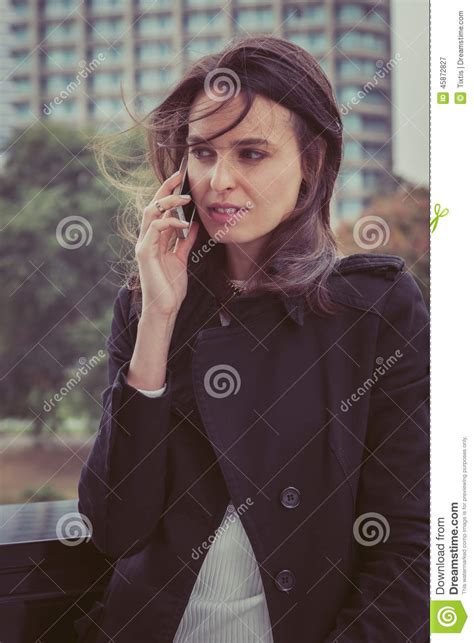 pretty girl talking on phone in the city streets stock image image of jeans beauty 45872827