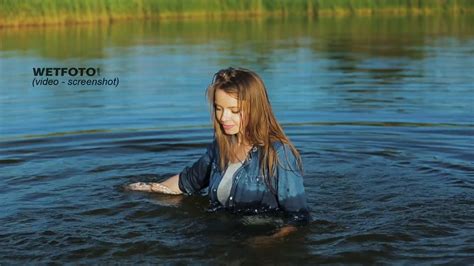 wetlook by smiling girl in wet tight jeans and gray t shirt without bra in the lake wetlook one