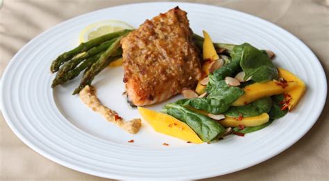 The fresh salmon fillet is first scaled and then washed thoroughly. Almond Crusted Salmon with Roasted Asparagus and Mango Spinach Salad