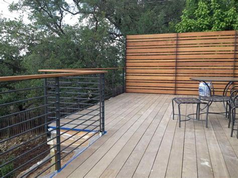 Wood railing designs for decks can use a continuous 2×6 to cap the posts. Horizontal Deck Railing Wood Plans Small Patio Design ...