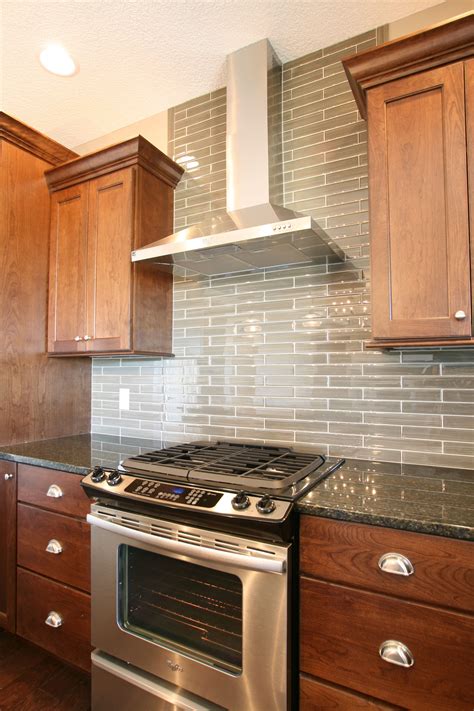 For a more modern feel, check out elongated sizes like 2 x 8, 3 x 12, 4 x 12 and 4 x 16. Tile Backsplash Behind Range Hood | Tile Design Ideas