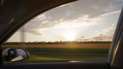 View From The Side Window Of A Car Driving Fast Along The Highway