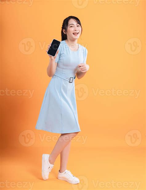 Young Asian Woman Wearing Dress On Background 21393553 Stock Photo At