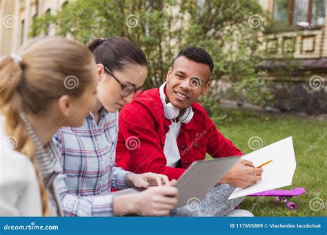 Three Busy Students On Campus Royalty Free Stock Photography