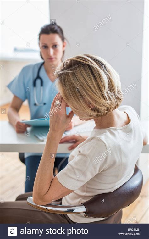 Doctor Discussing With A Female Patient Stock Photo Alamy