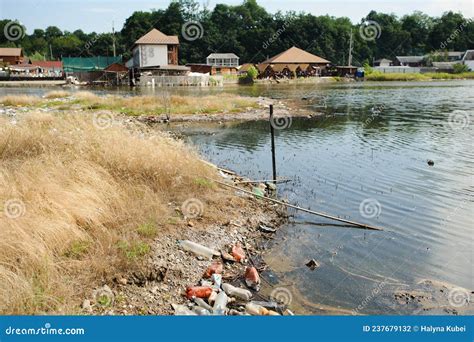 The Lake And The Shore Are Littered With Garbage Stock Photo Image Of