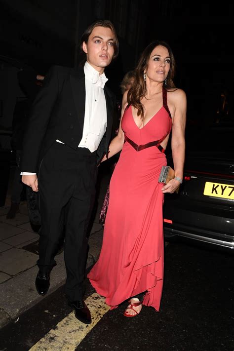 Elizabeth Hurley Stuns In A Red Dress At Joan Collins 88th Birthday