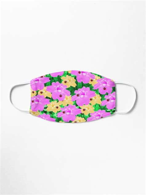 A Pink And Yellow Flower Print Face Mask
