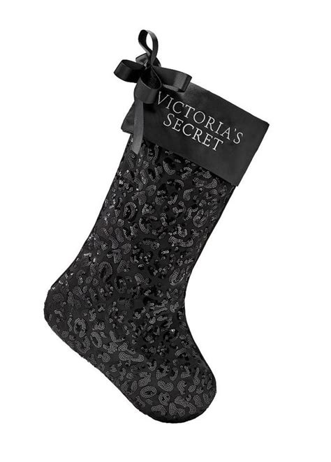 the victoria s secret christmas stocking is black and has a bow on it