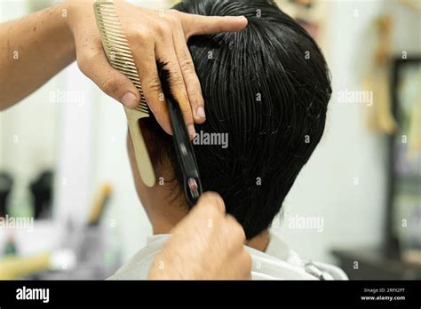 hair cut in barbershop asian people Stock Photo - Alamy