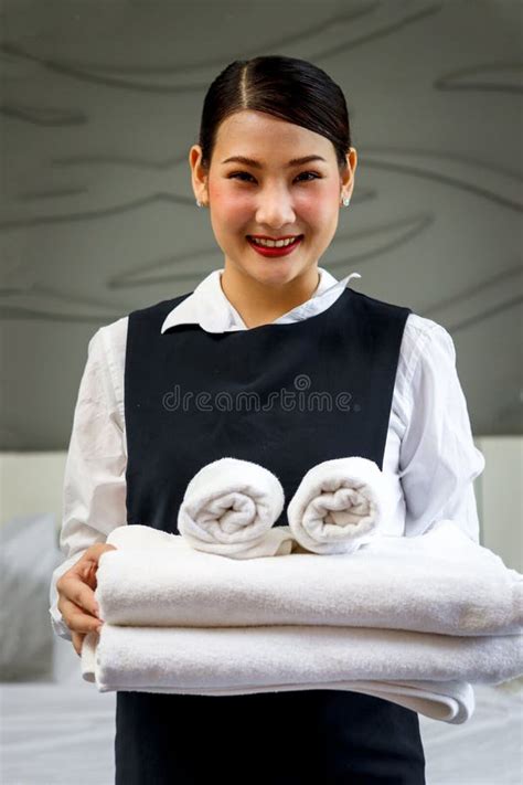 Room Service Maid Cleaning And Making Bed Hotel Room Concept Portrait