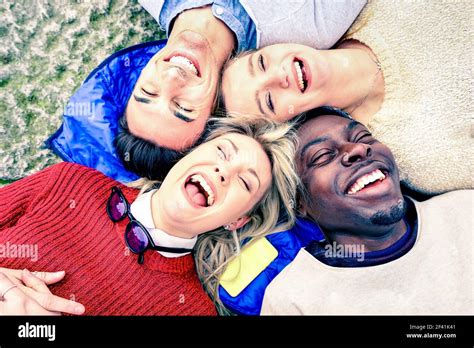 Multiracial Best Friends Having Fun And Laughing Together Outdoor At Springtime Happy