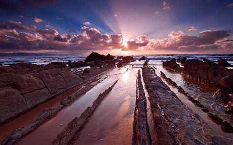 Wallpaper Sunlight Landscape Sunset Sea Rock Nature Shore Sand Reflection Sky Clouds