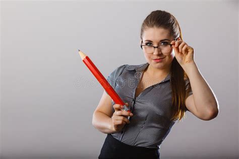 Teacher Wearing Eyeglasses Holding Pencil Stock Photos Free And Royalty