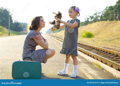 Mother And Daughter On The Train Platform Royalty Free Stock