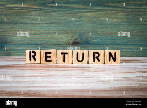 Return Word From Wooden Blocks On A Green And White Background Stock