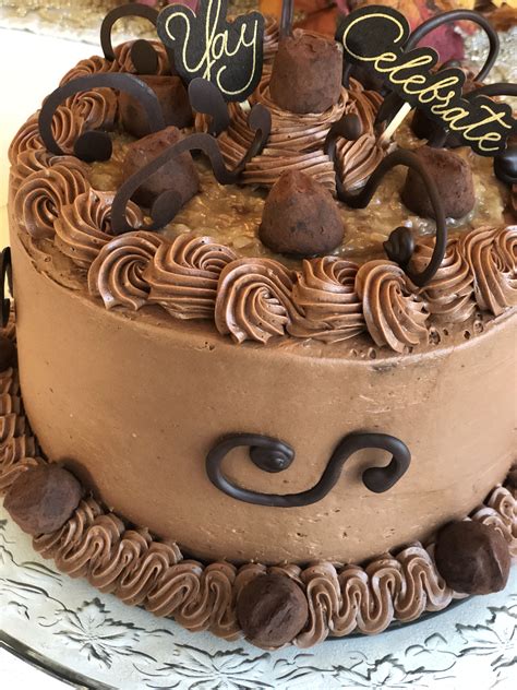 Three layers of moist chocolate cake that are stacked, one on top of another, with a so what is the history of the german chocolate cake? This is a labor of sweet love making this amazing and ...