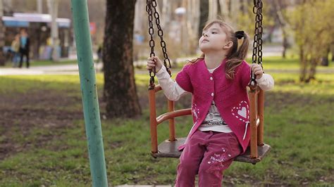 Sad Little Girl Swinging On A Swing Stock Video Footage 0020 Sbv