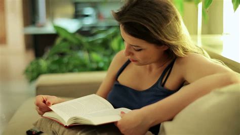 Tired Woman Finish Reading Book On Sofa At Night Stock Footage Video 6081212 Shutterstock