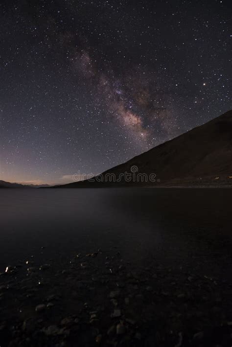 Starry Night With Milky Way With River And Mountain In Background