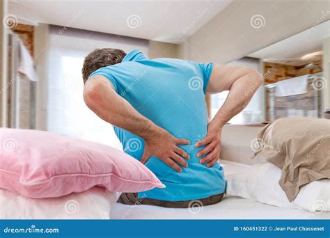 Senior Male Suffering Sharp Back Pain Sick Person Getting Up From Bed