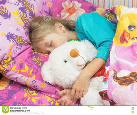 Beautiful Little Girl With A Toy Polar Bear Stock Image