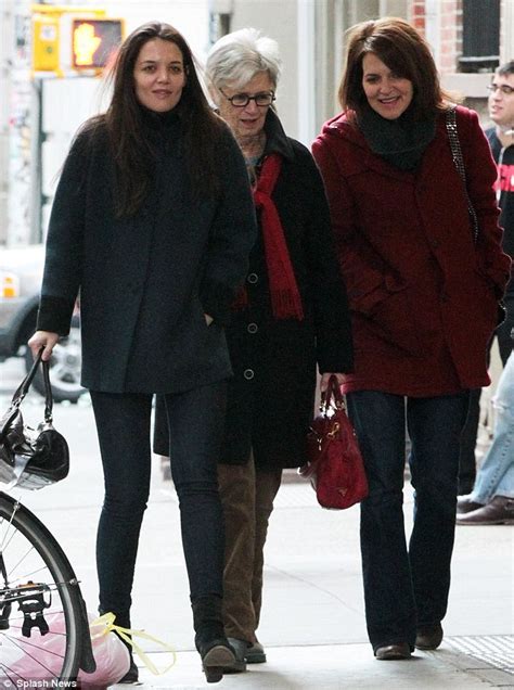 In the daytime she visited a catholic school. Suri Cruise has a big smile as Katie Holmes treats her to ...
