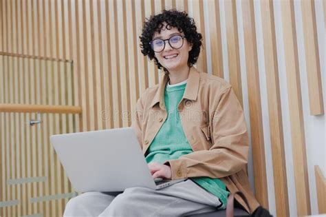 Happy European Woman With Laptop Is Working In Office Or Coworking