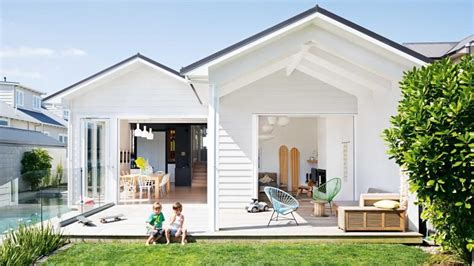 Outdoor Entertaining Space White Weatherboard Home Black Roof Blue