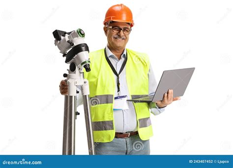 Smiling Geodetic Surveyor With A Measuring Equipment Stock Photo
