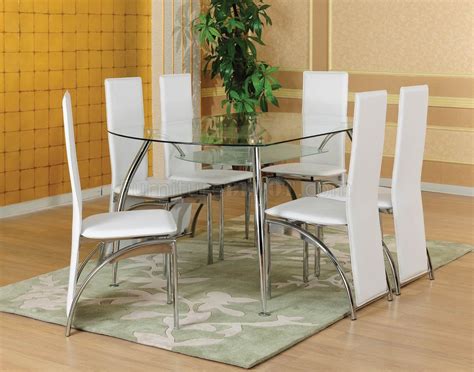 Would be great outdoors or make a great dining set for a smaller dining area. Clear Glass Top Modern 5Pc Dinette w/White Chairs