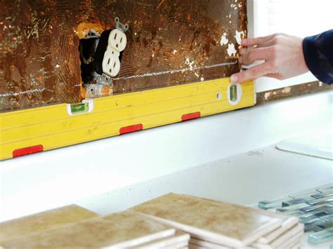 Do it yourself bri shows you how to install a glass tile backsplash. How to Install a Tile Backsplash | how-tos | DIY
