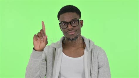 Disliking African Man Showing No Sign By Finger On Green Background