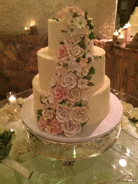 Three Tier Buttercream Wedding Cake With Spring Color Schemed Floral